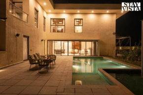 StayVista's The Sweet Life - Farm-View, Pet-Friendly Villa with Outdoor Pool, Terrace & Fireplace
